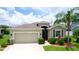 Well maintained home with mature landscaping, a two car garage, and neutral color palette at 7364 47Th Avenue E Cir, Bradenton, FL 34203