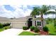 Charming single-story home with a well-manicured lawn, mature landscaping, and a two-car garage at 7364 47Th Avenue E Cir, Bradenton, FL 34203