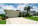 Charming home featuring a two-car garage, well-maintained lawn, and curb appeal at 7364 47Th Avenue E Cir, Bradenton, FL 34203