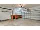 Spacious garage with ample storage and a workbench for projects and hobbies at 7364 47Th Avenue E Cir, Bradenton, FL 34203