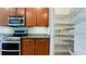 Well-equipped kitchen with stainless steel appliances and a walk-in pantry with shelving at 7364 47Th Avenue E Cir, Bradenton, FL 34203