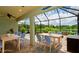 Spacious screened lanai featuring outdoor dining and seating areas for entertaining with beautiful water views at 7364 47Th Avenue E Cir, Bradenton, FL 34203