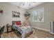 Cozy bedroom with a lively baseball theme, complete with a desk and comfortable seating near the window at 7628 Haddington Cv, Lakewood Ranch, FL 34202