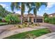 Beautiful home exterior with mature landscaping, brick driveway, and a two-car garage, creating an inviting curb appeal at 7628 Haddington Cv, Lakewood Ranch, FL 34202