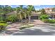 Charming one-story home featuring a tile roof, two car garage and lush tropical landscaping at 7628 Haddington Cv, Lakewood Ranch, FL 34202