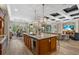 Open-concept kitchen featuring granite countertops, stainless steel appliances, and a spacious island at 7628 Haddington Cv, Lakewood Ranch, FL 34202