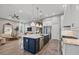 Bright, open kitchen with a marble countertop island and stainless steel appliances at 8209 Redonda Loop, Lakewood Ranch, FL 34202