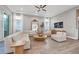 Spacious living room featuring modern furniture, wood floors, large windows, and contemporary décor at 8209 Redonda Loop, Lakewood Ranch, FL 34202
