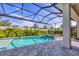 Enjoy the pool with screened-in enclosure, lush landscaping and a beautiful brick patio at 8209 Redonda Loop, Lakewood Ranch, FL 34202