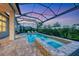 Beautiful pool and spa with screened-in enclosure, perfect for evening relaxation and entertaining at 8209 Redonda Loop, Lakewood Ranch, FL 34202