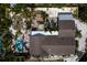 A serene aerial view reveals a private pool, verdant landscaping, and a cozy outdoor lounge area of the home at 8709 9Th Nw Ave, Bradenton, FL 34209