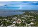 Wide aerial shot showing the home, surrounding neighborhood, and beautiful waterfront views at 8709 9Th Nw Ave, Bradenton, FL 34209