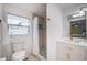 Bright bathroom featuring a single vanity, modern fixtures, and stylish shower with decorative tile at 8709 9Th Nw Ave, Bradenton, FL 34209