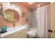 Bathroom featuring bright-colored walls, modern fixtures, and a stylish shower with decorative tile at 8709 9Th Nw Ave, Bradenton, FL 34209