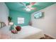 Bedroom features wood floors, bed and a TV on the wall at 8709 9Th Nw Ave, Bradenton, FL 34209