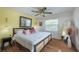 Bedroom featuring hardwood floors, a ceiling fan, and bright natural lighting at 8709 9Th Nw Ave, Bradenton, FL 34209