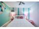 Stylish bedroom featuring unique flamingo themed decor and colorful wall art at 8709 9Th Nw Ave, Bradenton, FL 34209