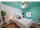 Bedroom with wood floors, colorful walls, and bed featuring unique headboard at 8709 9Th Nw Ave, Bradenton, FL 34209