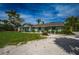 Charming home with a well-manicured front yard, a cozy porch, and fresh exterior paint at 8709 9Th Nw Ave, Bradenton, FL 34209