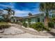Home with a well-maintained yard, mature landscaping, and a quaint walkway at 8709 9Th Nw Ave, Bradenton, FL 34209