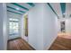 Hallway featuring stylish design elements leading to various rooms in the home at 8709 9Th Nw Ave, Bradenton, FL 34209