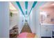 Hallway with unique lighting and colorful decor leading to bathroom at 8709 9Th Nw Ave, Bradenton, FL 34209