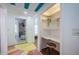 Hallway with a study nook featuring stylish design elements leading to various rooms in the home at 8709 9Th Nw Ave, Bradenton, FL 34209
