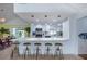 Modern kitchen features a large bar with seating, and stainless steel appliances at 8709 9Th Nw Ave, Bradenton, FL 34209