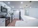 Bright kitchen features white cabinets, stainless steel appliances, and a large marble countertop island at 8709 9Th Nw Ave, Bradenton, FL 34209