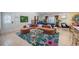 Bright living room with a comfortable sofa, accent rug, pool table, modern decor and plenty of natural light at 8709 9Th Nw Ave, Bradenton, FL 34209