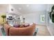 Open concept living room with plank flooring, a modern sectional sofa, and a breakfast bar with seating at 8709 9Th Nw Ave, Bradenton, FL 34209