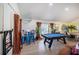 Spacious entertainment area with a pool table, seating, and bar, perfect for gatherings and relaxation at 8709 9Th Nw Ave, Bradenton, FL 34209