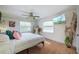 Bright bedroom featuring hardwood floors, modern decor, and abundant natural light at 8709 9Th Nw Ave, Bradenton, FL 34209