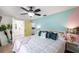 Bright bedroom has a doorway leading to an ensuite bathroom with ample space at 8709 9Th Nw Ave, Bradenton, FL 34209