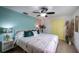 Bright bedroom features light colored walls, ceiling fan, and ample closet space at 8709 9Th Nw Ave, Bradenton, FL 34209