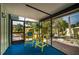 Relaxing screened-in patio with vibrant seating and views of the tropical garden at 8709 9Th Nw Ave, Bradenton, FL 34209
