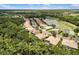 Scenic aerial shot of a residential community near a pond and golf course, surrounded by a verdant landscape at 8840 Brookfield Ter, Bradenton, FL 34212