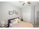 This bedroom features a ceiling fan, closet, soft decor, and lots of natural light at 8840 Brookfield Ter, Bradenton, FL 34212