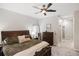 Spacious bedroom with ceiling fan, carpeted floors, and a walk-in closet at 8840 Brookfield Ter, Bradenton, FL 34212