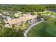 Aerial view of the clubhouse with outdoor patio seating overlooking the golf course at 8840 Brookfield Ter, Bradenton, FL 34212