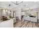 Open-concept dining room with modern light fixture and views into the living area and outdoor space at 8840 Brookfield Ter, Bradenton, FL 34212