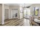 Inviting entryway featuring frosted double doors, transom windows, and wood-look flooring at 8840 Brookfield Ter, Bradenton, FL 34212