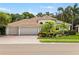 Charming single-story home featuring a beautiful tile roof, three-car garage, and well-manicured landscaping at 8840 Brookfield Ter, Bradenton, FL 34212