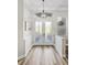Bright foyer with wood flooring, decorative frosted double doors, and a modern chandelier at 8840 Brookfield Ter, Bradenton, FL 34212