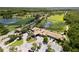 An aerial view of the golf community featuring a clubhouse, golf course and ponds at 8840 Brookfield Ter, Bradenton, FL 34212