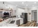 Open concept kitchen with granite countertops, stainless steel appliances, and view to Gathering room at 8840 Brookfield Ter, Bradenton, FL 34212