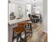 Kitchen with granite countertops, stainless steel appliances, and barstool seating at kitchen island at 8840 Brookfield Ter, Bradenton, FL 34212