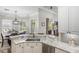 Kitchen features granite countertops, stainless steel appliances, and backyard views to the pool at 8840 Brookfield Ter, Bradenton, FL 34212