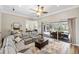 Comfortable living room with open floor plan, sliding glass doors, and stylish decor at 8840 Brookfield Ter, Bradenton, FL 34212