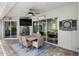 Outdoor patio with a dining area, ceiling fan, dart board, and views of the pool at 8840 Brookfield Ter, Bradenton, FL 34212